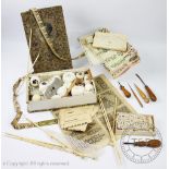 A selection of 19th century and later sewing and needle work ephemera to include six bone needles,