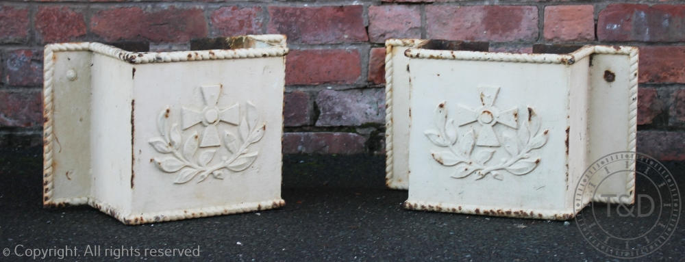 A pair of late 19th century cast iron drain hoppers, cast with a cross and laurel leaves,