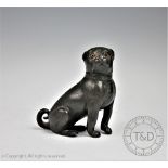 A 19th century novelty pewter pepperette modelled as a pug, designed seated and with a screw cap,