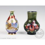 A Moorcroft Iris pattern vase, decorated with two floral sprays against a green ground,