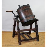 A cast iron and wood butter churn by Bamber & Co of Preston,