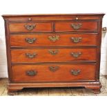 A George III style mahogany chest of drawers, with two short and three graduated long drawers,