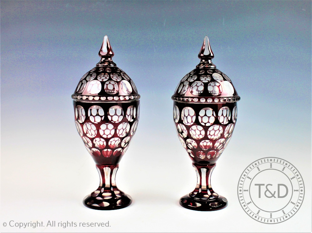 A pair of late 19th century Bohemian ruby flashed glass vases and covers, of ovoid form,33.