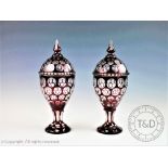 A pair of late 19th century Bohemian ruby flashed glass vases and covers, of ovoid form,33.