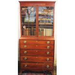A Regency mahogany secretaire bookcase, with two astragal glazed doors above three long drawers,