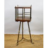 An Edwardian oak and brass revolving bookcase, (legs at fault),