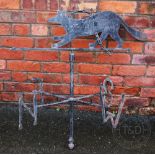 A wrought and cast iron weather vane, modelled with an animal - possibly a fox,