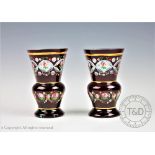 A pair of Bohemian ruby flashed glass vases, painted with flowers,