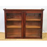 A 19th century mahogany two door display cabinet,