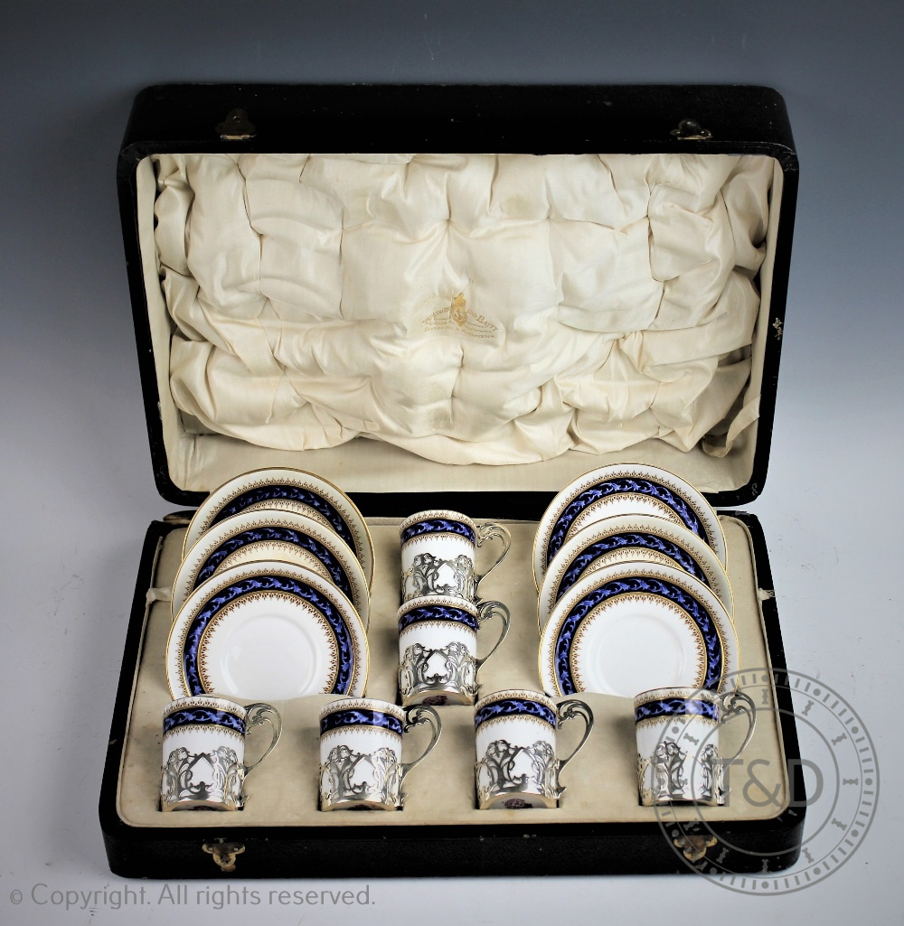 A Royal Worcester silver mounted twelve piece coffee service, the silver cup holders London 1917,