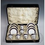 A Royal Worcester silver mounted twelve piece coffee service, the silver cup holders London 1917,