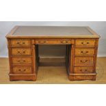 A Victorian style walnut pedestal desk,