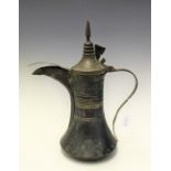 A Middle East Arabic Dallah type coffee pot, copper and brass, with engraved detailing,