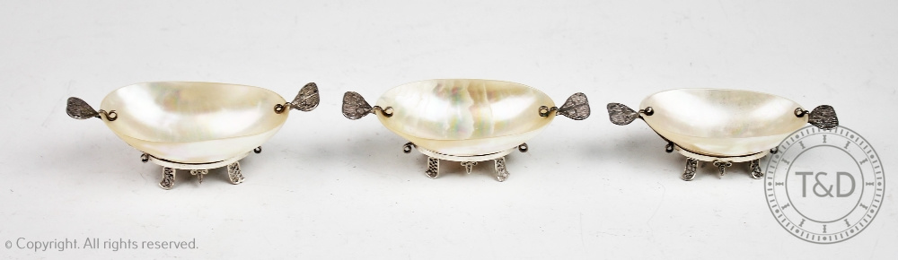 A set of three Russian white metal mounted mother of pearl caviar servers,