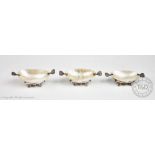 A set of three Russian white metal mounted mother of pearl caviar servers,