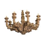 LAMPADARIO ad otto fiamme in legno riccamente intagliato. Spagna XIX secolo Misure: h cm 86