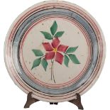 FANGOTTO in ceramica smaltata e decorata. Sicilia XIX secolo Misure: diametro cm 43,5