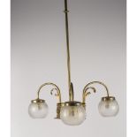 LAMPADARIO Liberty in ottone a tre luci con bocce in vetro. Sicilia primi '900 Misure: h cm 93