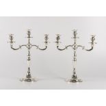 COPPIA CANDELABRI a tre fiamme in argento (g. 827). XX secolo Misure: cm 33 x h39