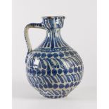 BROCCA in ceramica smaltata e decorata nei toni del blu. XIX secolo Misure: h cm 30