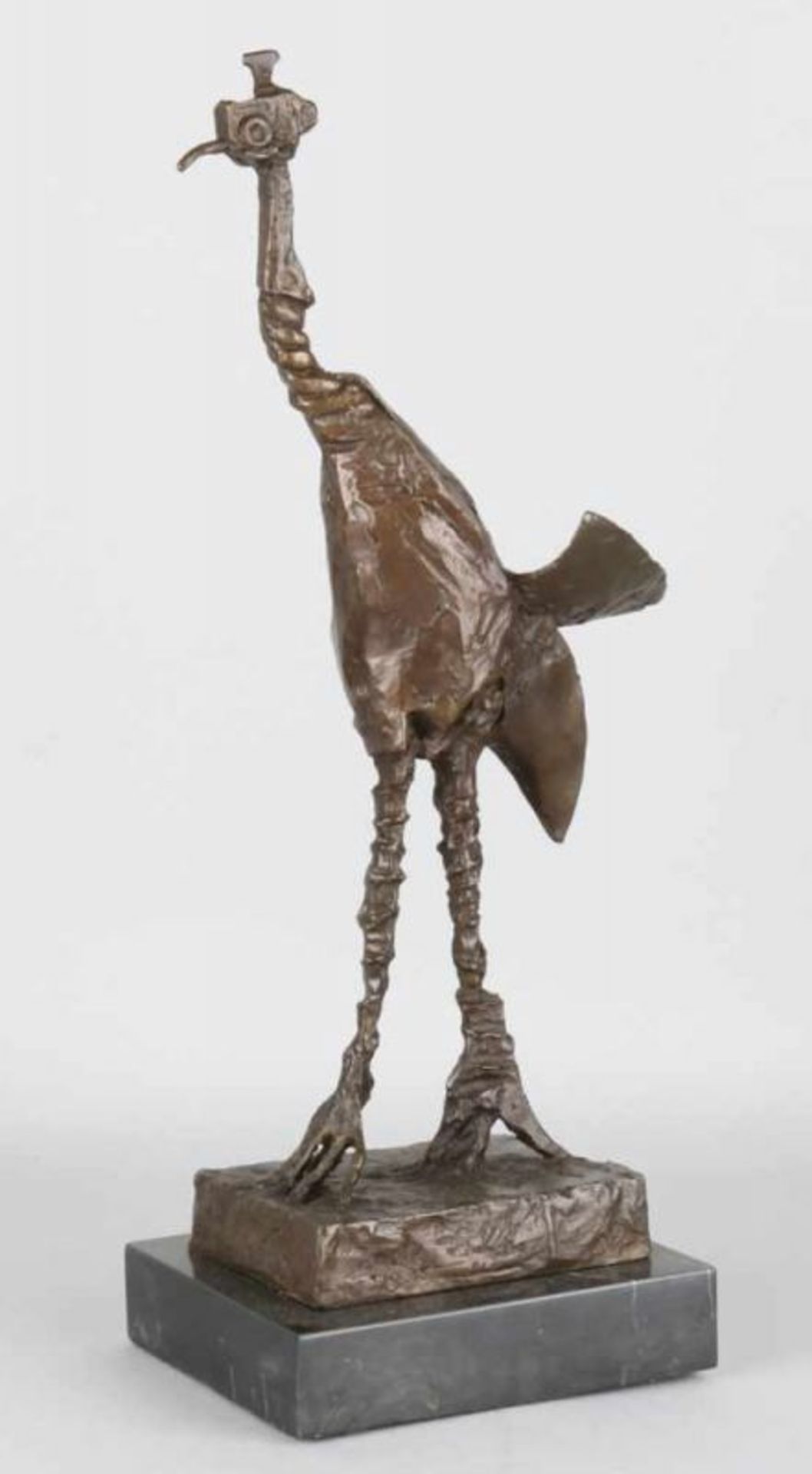 Modern bronze ostrich on black marble base. 21st century. Unsigned. Size: 46 cm. In good
