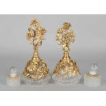 Four times design perfume bottles. 20th century. Twice with gold plated brass decorations (