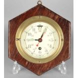 Old English brass ship clock with central seconds hand on oak plaque. Circa: 1940. Size: 10 x 16