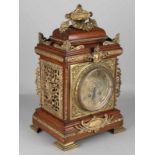 Rich antique French or German walnut with bronze table clock. Clock has brass dial, eight-day