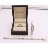 Three-piece set Pequignet with a ring, bracelet and watch, steel with yellow gold. Width 5 mm, ø 52,