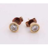 Yellow gold ear studs, 585/000, with diamonds. Two yellow gold round smooth conversions set with a