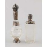 Two odeo vials with silver, 835/000. A belly model bottle on silver base, with silver neck and cap