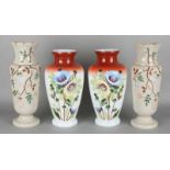 Four antique hand-painted opaline glass vases with floral decors. Circa 1900. Size: 32 - 36 cm. In