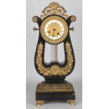 Early 19th century French Lyra Empire pendulum with mahogany veneer and enamel dial. Basement