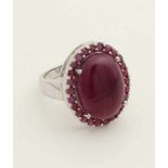 Silver ring with round ruby ​​925/000, and a border set with small rubies, all cabouchon cut. size