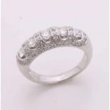 Capital white gold ring, 750/000, with diamond. Convex ring with a row set with 5 brilliant cut