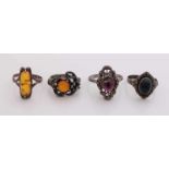 Four silver rings with stones, including amber. total about 14 grams Vier Silberringe mit Steinen