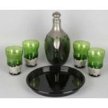 Six-piece glass Dutch liquor set with black pressed glass tablet and Gero tin holders. Circa: