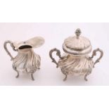 Silver cream set, 800/000, Rococo style, Italian, placed on legs with lion heads and decorated