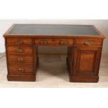 Antique English oak writing desk. Two-sided loading and doors in lower parts. Circa 1900. Size: