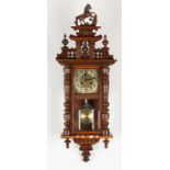 Antique German walnut regulator with original horse crown and facet cut glass. Circa 1900. Size: