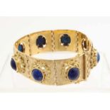 Yellow gold bracelet, 750/000, with lapis lazuli. Wide bracelet with square worked links, provided