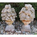 Two large concrete garden ornaments with fruit. 20th century. Size: 65 x 35 cm ø. In good condition.