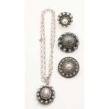 Lot of silver jewelry with zeeuwse buttons, 925/000, a ring, two brooches with a round button and