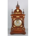 Antique German walnut table clock with brass fittings. Gründerzeit. Circa 1890. With half hour-