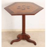 Early 19th century mahogany six-cornered table with birch veneer and floral intarsia on top. With