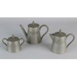 Three-piece antique pewter mocha set with engravings. Circa 1900. Size: 8 - 12 cm. In good