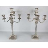 Two special silver candlesticks, 925/000, on square base with pearl rim with a corinthian column and