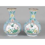 Two antique Japanese enamelled vases with floral decors. First half of 20th century. Size: 16 x 10