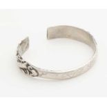 Silver clamp band, 800/000, with engraving and machined ends with imposed curls. ø 68x55mm, ca 41