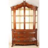 Antique Dutch oak baroque-style porcelain cabinet, one door, with brass fittings, standing on claw